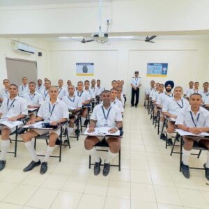 Students seated in classroom uniform.