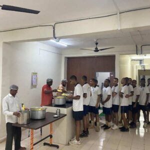 Students lining up for food service.